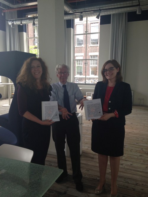 Proud of the results so far, and thanking EUA for their support from the start by giving the first copy to EUA's Enora Pruvot (in the background: chairman Hans Beunderman, former dean and vice rector TU Delft)